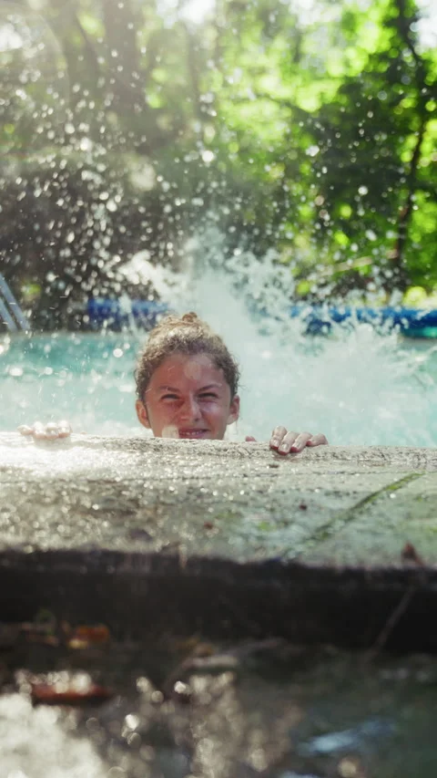 Girl Doing Flutter Kicks While Holding Onto The Pool Coping Stock Footage 283629419