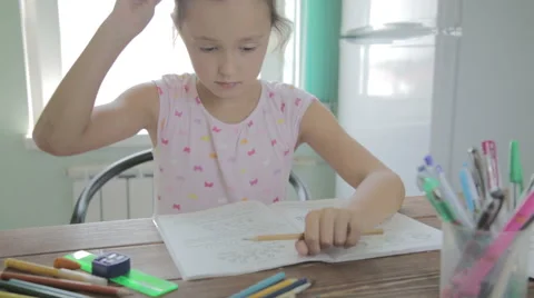 Girl is doing homework for elementary school. Stock Footage 52317859