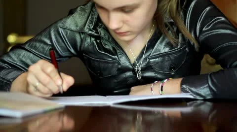 Girl doing homework. Stock Footage 11799369
