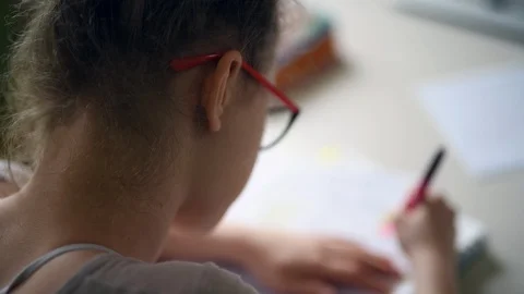 Girl doing homework Stock Footage 88567626