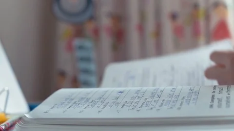 Girl doing homework Stock Footage 89063655