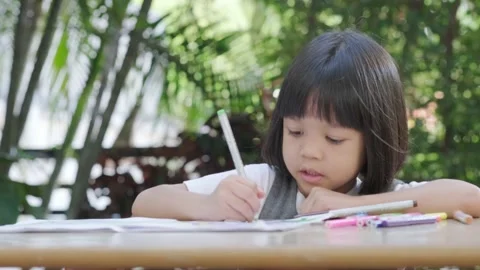 Girl doing homework Stock Footage 146295003