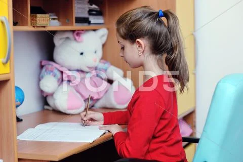 Girl doing homework Stock Photos