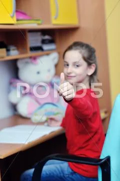Girl doing homework Stock Photos