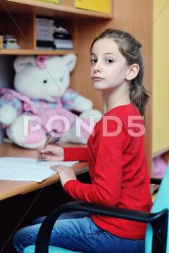 Girl doing homework Stock Photos