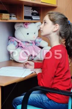 Girl doing homework Stock Photos