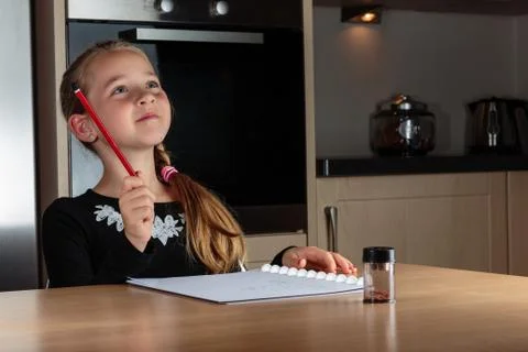 Girl doing homework Stock Photos