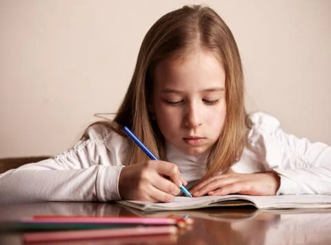 Girl doing homework Stock Photos