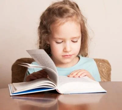 Girl doing homework Stock Photos