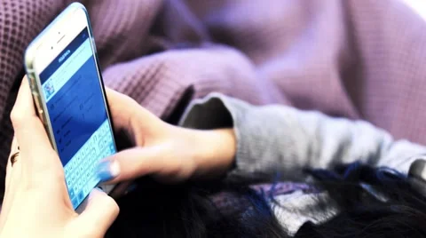 Girl doing an Instagram post through Iphone Stock Footage 53428413