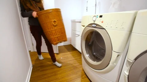 Girl doing laundry Stock Footage 100694956