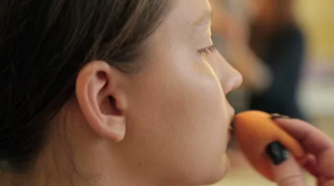 Girl doing make-up in studio Stock Footage 68460051