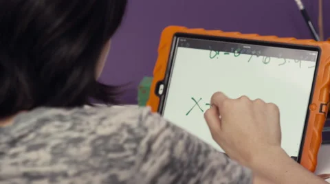 Girl doing mathematic on digital tablet Stock Footage 63861774