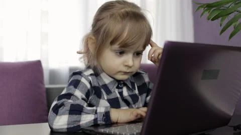 Girl doing online lessons using digital laptop computer. Distance education Foto stock