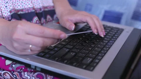 Girl doing online purchases using the laptop Stock-Footage 51859235