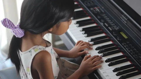 Girl doing piano exercise Stock Footage 53784970