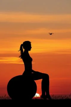Girl doing pilates at sunset Stock Illustration