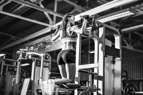 Girl doing pull ups Stock Photos
