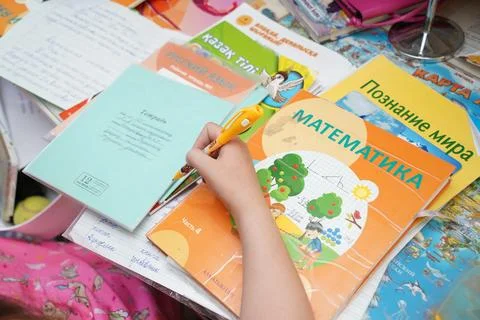 The girl is doing school homework Photos