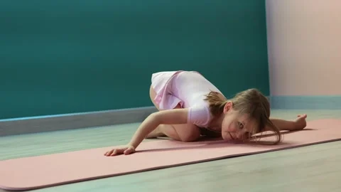 Girl doing shoulder mobility exercise Stock Footage 327714737