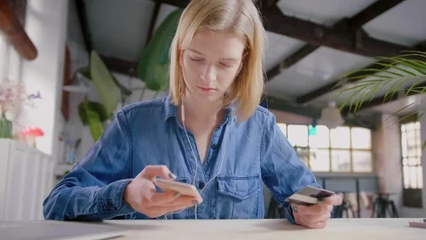 Girl doing transaction with or repay enters credit bank card number to mobile Stock Footage 103286287