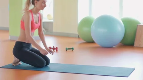 Girl doing warming up exercise for spine, backbend, arching stretching her back Stock Footage 73881609