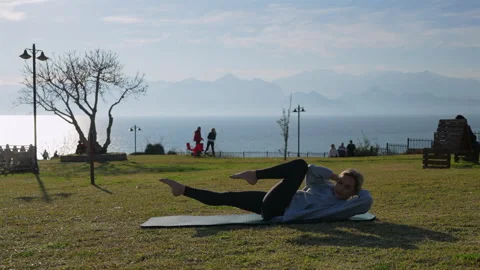 Girl is doing workout in the park Stock Footage 301913080