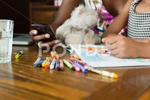 Girl Drawing With Crayons