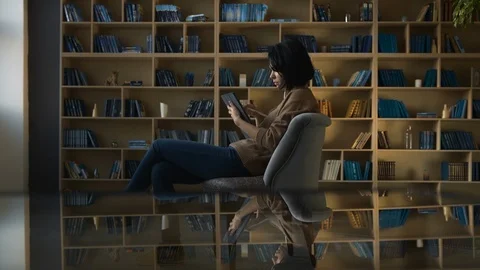 Girl drawing on digital tablet device in library. Modern education concept Stock Footage 104010121