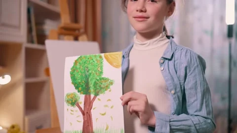A girl with a drawing. Video stock 197814230