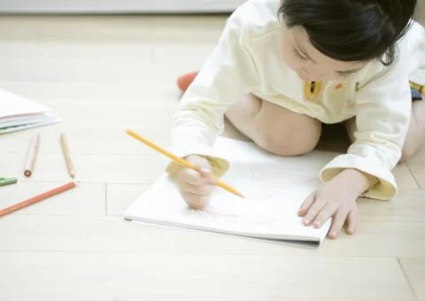 Girl drawing Stock Photos