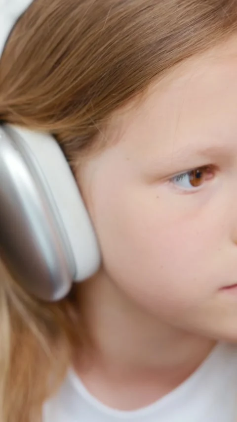 Girl drawing while glancing for reference Stock Footage 313048982