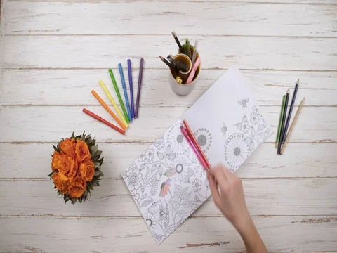 The girl draws with colored felt-tip pens. Top view. Hands close up view. Stock Footage 84888571