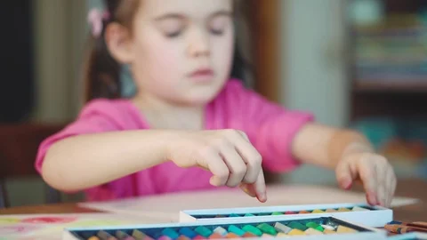 Girl draws with crayons at the table Stock Footage 72411124