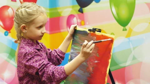 Girl draws on the easel.close-up Stock Footage 101979306