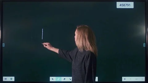 Girl draws on an interactive whiteboard Stock Footage 82306514