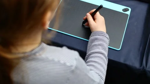 Girl draws on the tablet Stock Footage 62076460