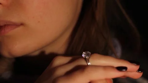 The girl is dressing up. A ring with a large gem on a girl's finger Stock Footage 220520920