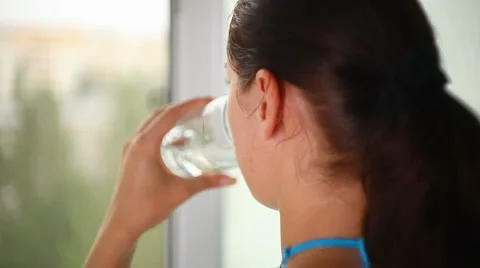 Girl drinking clean water Stock Footage