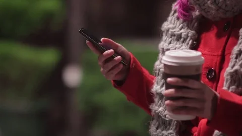 Girl drinking coffee and using phone Stock Footage 70214808