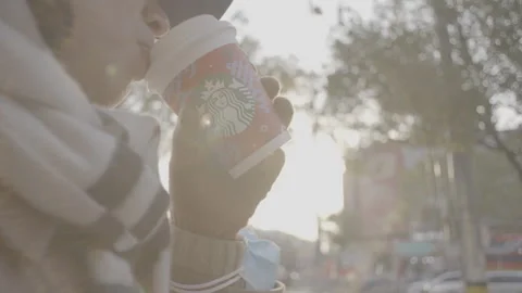 Girl drinking coffee, backlight, slow motion 스톡 동영상 259711749