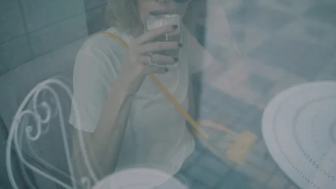 Girl drinking coffee in a cafe Stock Footage 99657035