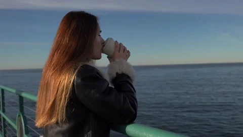 Girl drinking coffee on Redondo beach pier, los angeles, california - oct 2022 Stock Footage 238987635