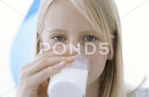Girl Drinking Glass Of Milk, Close-Up