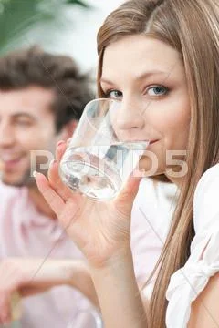 Girl Drinking Glass Of Water At Home