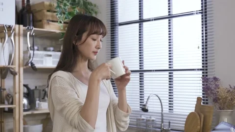Girl drinking morning coffee while looking afar Stock Footage 140889206