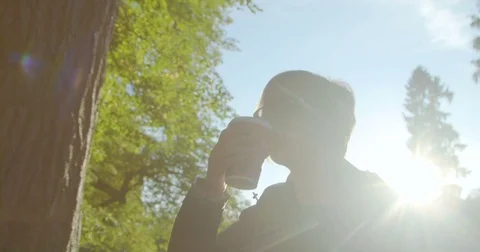 A girl is drinking tea or coffee on the go Video stock 80250452
