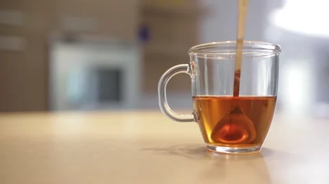 Girl drinking tea at the table Stock-Footage 68199616
