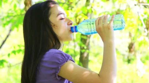 Girl drinking water Stock Footage 24671032