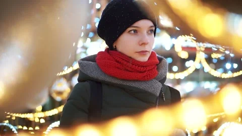 Girl drinks coffee against the background of New Year's garlands Stock Footage 201608069